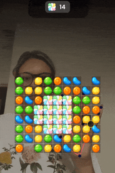 Gif depicting Reactiv Candy Match Game using hand to control game motion
