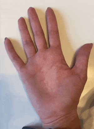 GIF depicting a hand on a white background. Hand is opening and closing into a fist. 